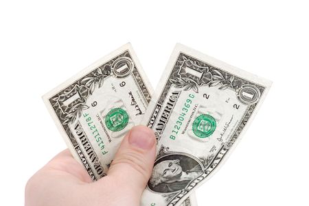 The hand holds two dollars, isolated on white