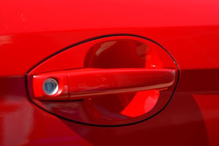 The modern handle of a door of the red carの写真素材