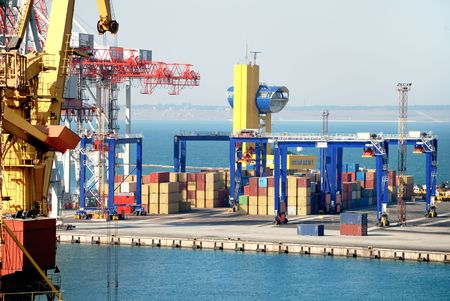 Port warehouse with containers and industrial cargoesの写真素材