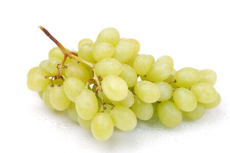 One whole cluster of green grapes with drops on whiteの写真素材