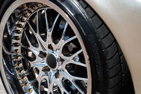 Closeup the chromeplated rim of a wheel