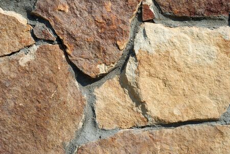 Background from a decorative brown stone of the different sizesの写真素材