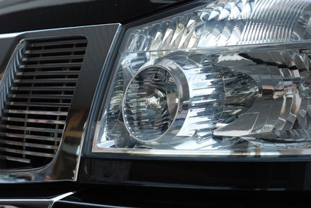 Forward headlight and hood of the black carの写真素材