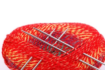 A ball of red wool isolated on whiteの写真素材