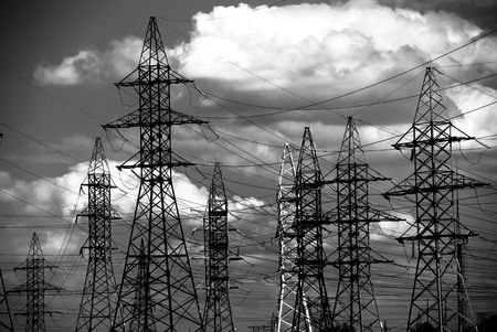 Dark stylized high voltage electric line at the fieldの写真素材