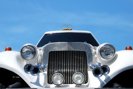 White wedding limousine decorated with flowersの写真素材