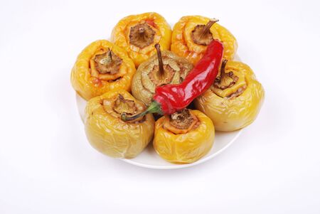 Stuffed paprika and pepper on a plate isolatedの写真素材