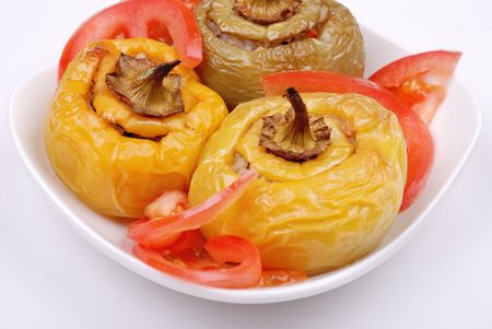 Stuffed paprika and pepper on a plate isolatedの写真素材