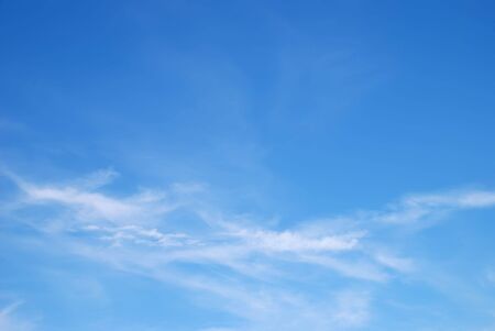 Fantastic soft white clouds against blue skyの写真素材