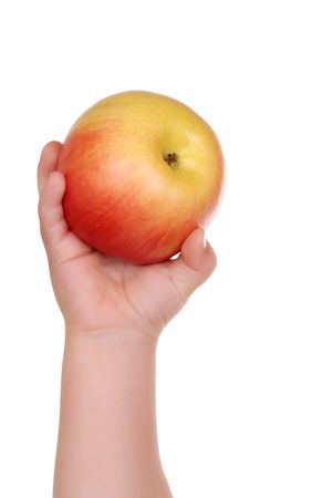 The children's hand holds a apple isolatedの写真素材