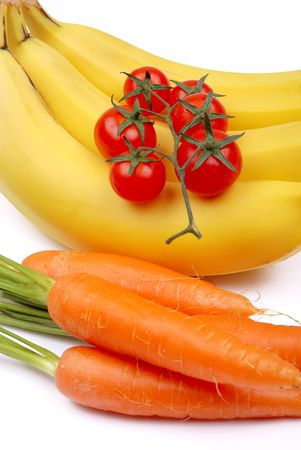 Bunch of bananas, tomatoes and carrot on white の写真素材
