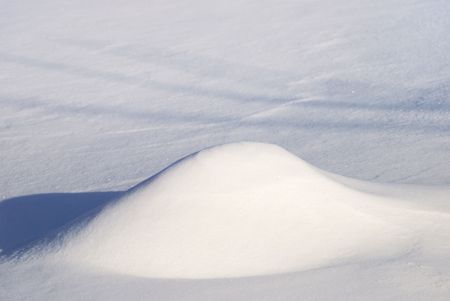 Winter background from bright snow and a snowdriftの写真素材