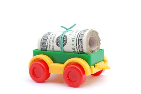 The toy tractor transortation money on white backgroundの写真素材
