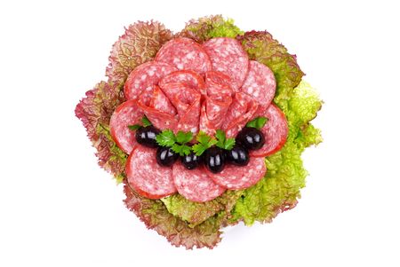 Tasty sausages on a plate with salad and olivesの写真素材