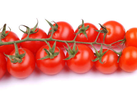 Cherry tomatoes isolated on white backgroundの写真素材