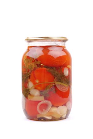 The clear glass jar of colorful pickled vegetables on whiteの写真素材