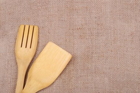 Wooden cooking utensils on a sackcloth backgroundの写真素材