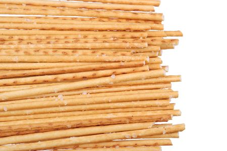 Stack of salted breadsticks isolated on whiteの写真素材