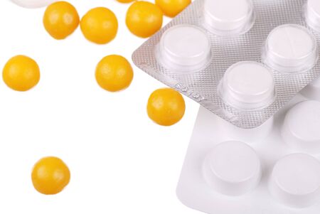 Various tablets and vitamins isolated on whiteの写真素材