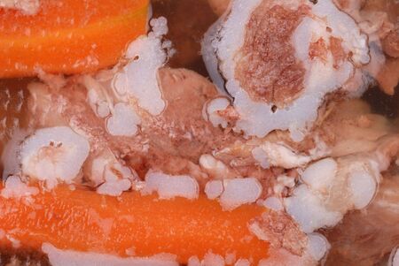Background from aspic meat jelly with carrot and other vegetablesの写真素材
