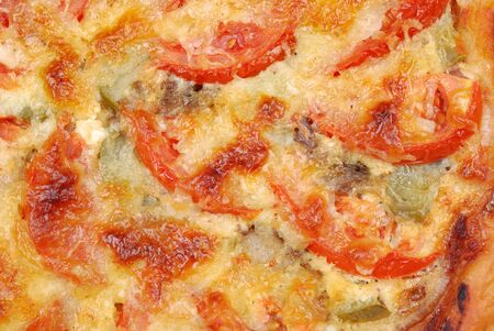 Background from a homemade pizza with tomatoの写真素材