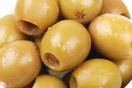 Macro photo of green olives on whiteの写真素材