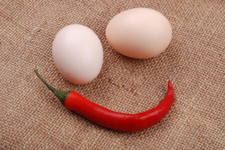 Two eggs on a rough sackclothの写真素材