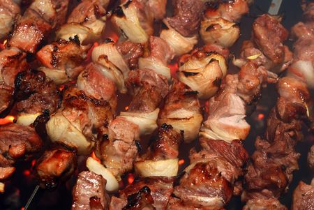 Closeup of meat cooking on a skewerの写真素材