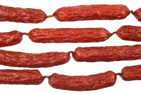 Background of tasty sausages isolated on whiteの写真素材