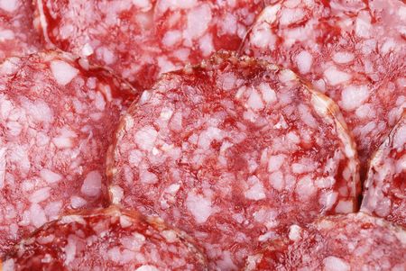 Background of tasty sliced  sausages on whiteの写真素材