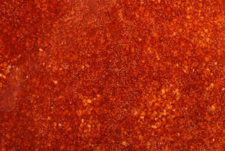 Closeup of red glaze background with bubblesの写真素材