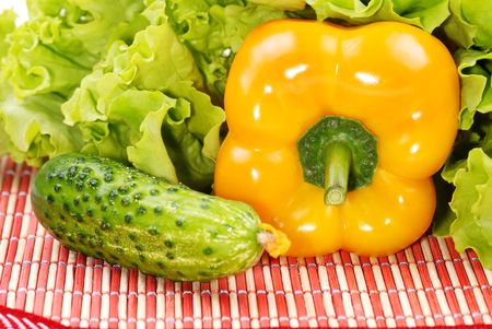 Vegetables. Yellow pepper, cucumber and greensの写真素材
