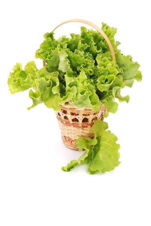 Basket with green lettuce salad isolatedの写真素材