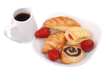 Fresh buns and strawberry on white plate isolatedの写真素材