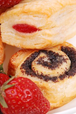 background from fresh buns and  strawberry on a plateの写真素材