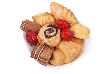 Fresh buns and strawberry on white plate isolatedの写真素材