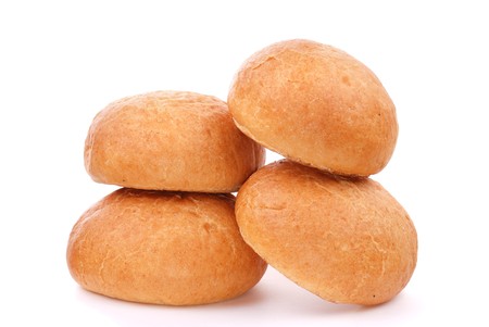 Three fresh buns isolated on whiteの写真素材