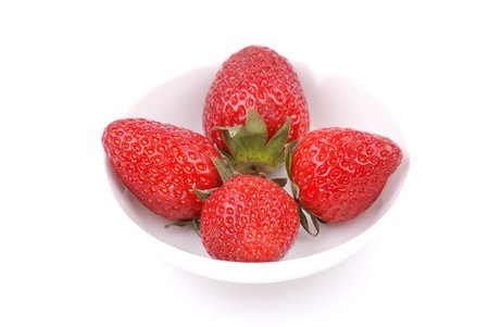 Group of fresh strawberry on white plateの写真素材