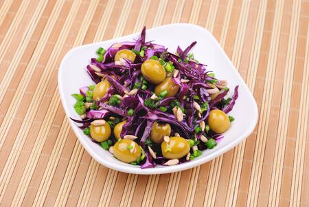 Fresh salad from cabbage, olives and other vegetablesの写真素材