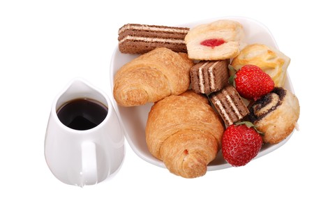 Fresh buns and strawberry on white plate isolatedの写真素材