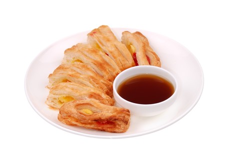 Fresh buns on a white plate isolatedの写真素材