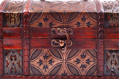 closed and locked treasure chest on white backgroundの写真素材