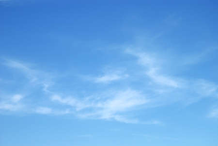 Fantastic soft white clouds against blue skyの写真素材