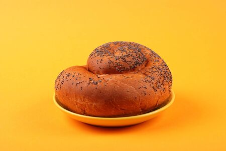 The fresh bun on yellow backgroundの写真素材