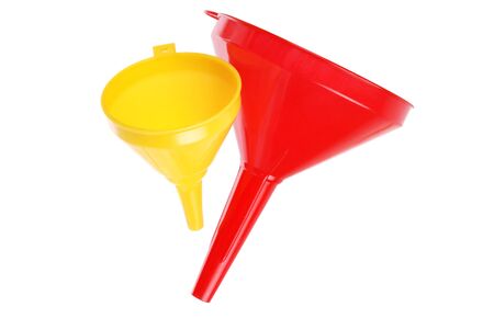 red and yellow plastic funnel isolated on whiteの写真素材
