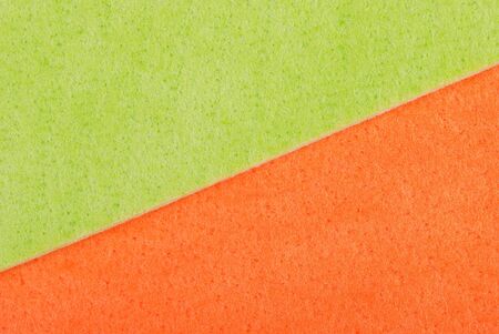 Green sponge for washing dishes as a backdropの写真素材