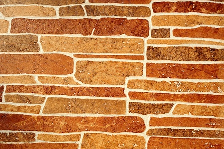 Abstract background from brown stone wall
