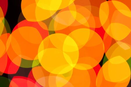 yellow on black bokeh backgroundの写真素材