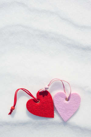 two hearts on snow backgroundの写真素材
