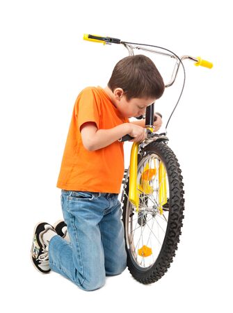 boy repair bicycle isolated on whiteの写真素材